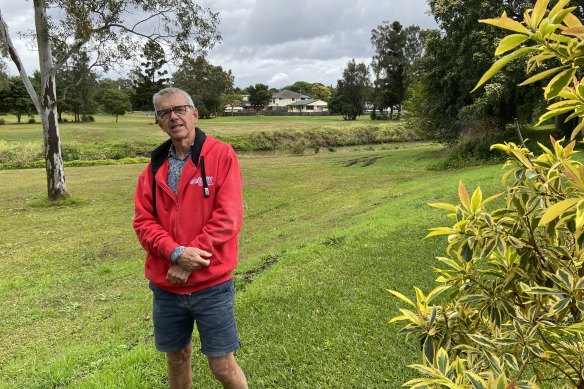 Twice-flooded Yeronga resident Paul Hanley says regular flash flooding brings water up the bank behind his home. Mr Hanley is one of 28 residents calling on Brisbane City Council to remove illegal fill behind a Yeronga industrial property to stop water backing up.
