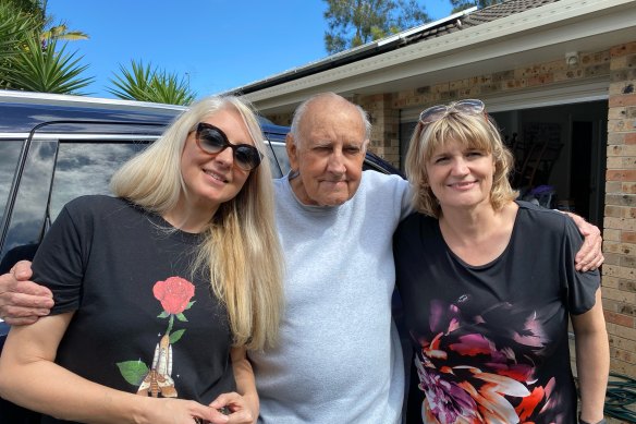 Christina, left, and Caroline Coulston with their father Tony Coulston, who died from falling out of bed at Port Macquarie Base Hospital in 2021. 