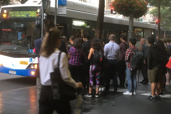 Commuters queue for the 389 bus to Pyrmont.
