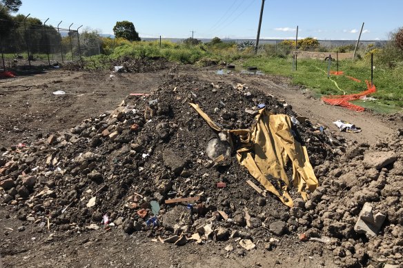 Discarded soil in Hume. Such waste must be treated and filtered once it is removed.