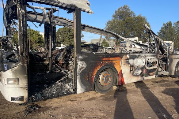 The burnt out remains of a public bus that burst into flames on the West Gate Bridge on Monday evening.