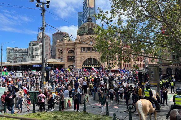 Protesters block the intersection of Flinders and Swanston streets during a rally last month.