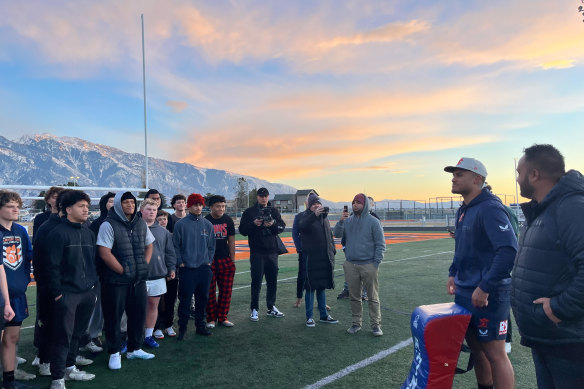 Sydney Roosters player Spencer Leniu (right) talks with members of the Brighton Bengals.