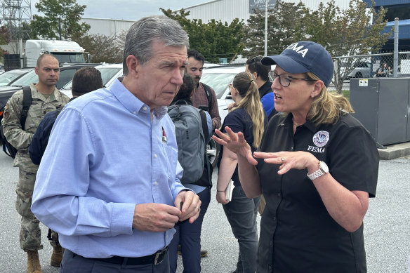 “It’s the worst I’ve ever seen it”:  Deanne Criswell, head of the US Federal Emergency Management Agency, (right) says misinformation is hampering its work.
