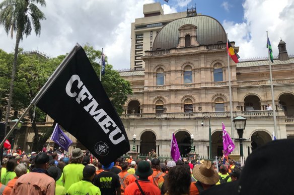 CFMEU members rally outside the Queensland parliament.