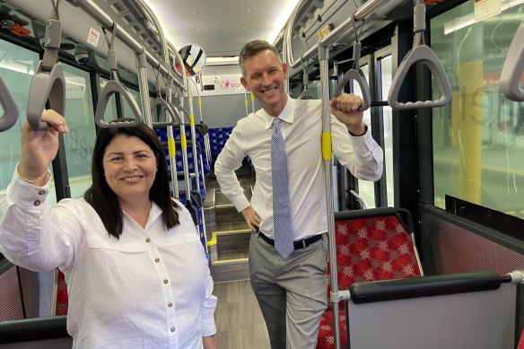 MP Grace Grace and Transport Minister Mark Bailey on an electric bus in Brisbane.