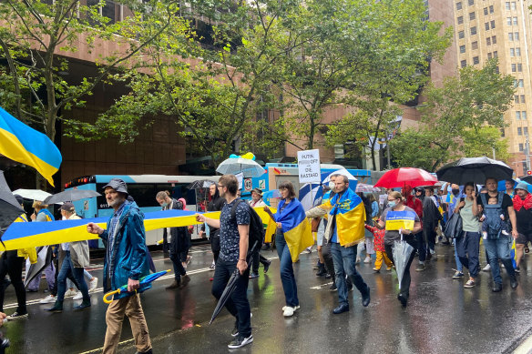 Protesters in Ukraine’s blue and yellow national colours rally in Sydney on Saturday.