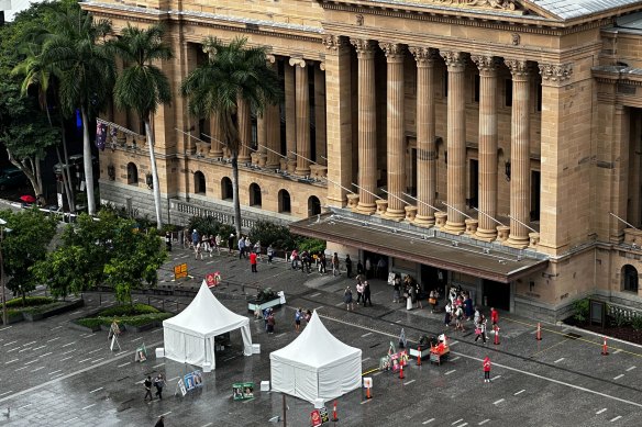 Voters lining up to cast their ballots early in the Queensland local government elections at Brisbane City Hall this morning.