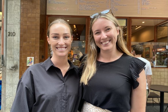 Back in the office: law firm workers Caitlyn Bellis and Emily Wood reunited in the CBD with a lunch break felafel.