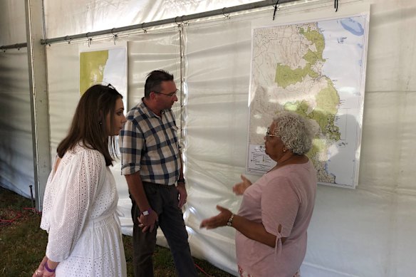 Kuku Yalanji traditional owner Chrissy Grant (right) explains elements of the handover of four national parks between Cooktown and Port Douglas - including the Daintree - to Queensland Environment Minister Meaghan Scanlon and Aboriginal and Torres Strait Islander Minister Craig Crawford.