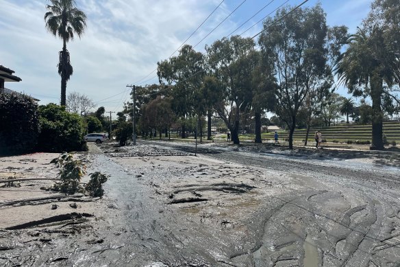 Thick mud sits along Chifley Drive in Maribyrnong on Monday.