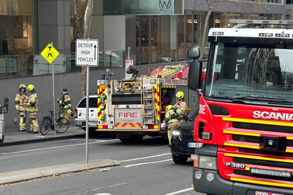 Firefighters in Flinders Lane this morning.