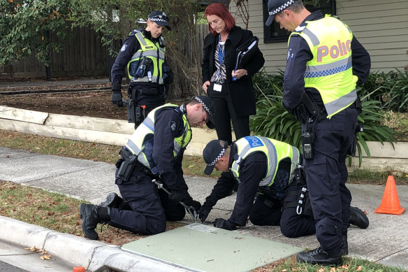 Police investigate the shooting of Andrew Toumayan in April 2018.