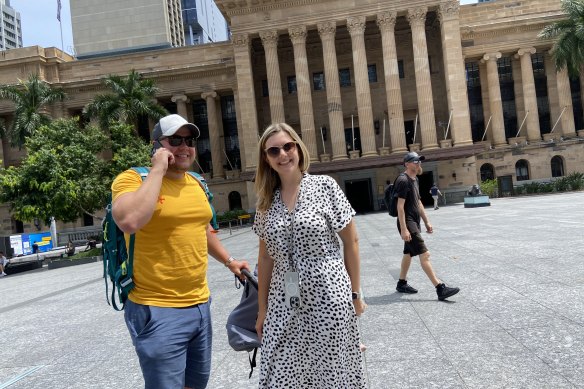 German tourist Lena Herweg (centre) was impressed by City Hall, but less so by the heat radiating up from King George Square.