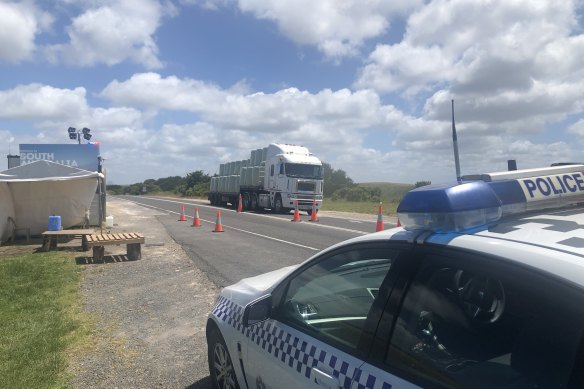 South Australian police at the South Australia-Victoria border near Nelson on Wednesday. 