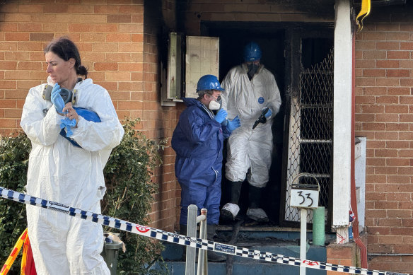 Police and forensics attend the scene after three children died in a house fire on Freeman Street in Lalor Park.