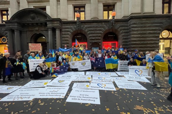 Protesters gather outside Melbourne Town Hall on Tuesday afternoon ahead of Melbourne City Council’s decision to cut sister city ties with the Russian city of St Petersburg.