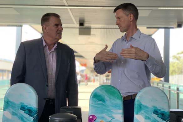 Local MP Mark Furner and Queensland Transport Minister Mark Bailey at the new smart gates at the Ferny Grove train station.