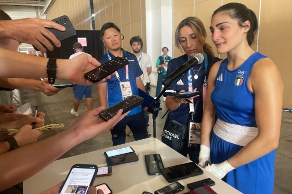 Angela Carini in tears at the post-fight press conference.