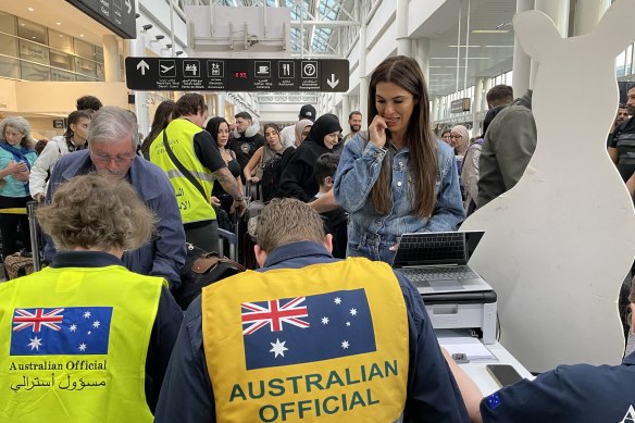 Australian government officials assisting Australians to depart Lebanon.