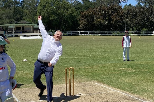 Prime Minister Scott Morrison bowls against Brookfield students in Brisbane’s west before batting away questions on the proportion of grants handed to Coalition seats.