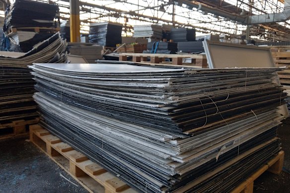 Solar panel components waiting for recycling at a Reclaim PV warehouse. 