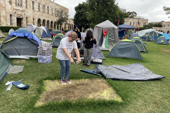 A Students for Palestine member shows where she’s been sleeping for the past month as part of the Gaza solidarity encampment. 