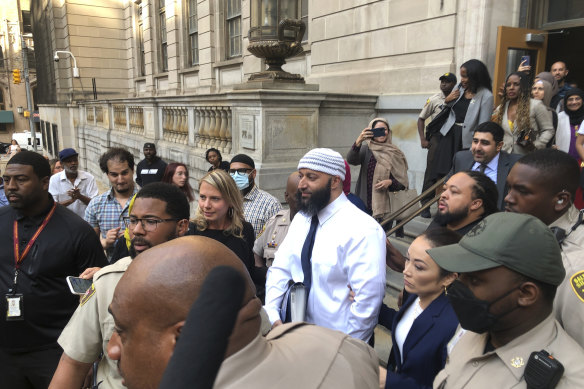 Adnan Syed (centre) leaves court after his conviction was overturned in September 2022.