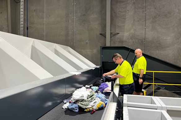 Items are first sorted by humans, who decide whether they are suitable for recycling.