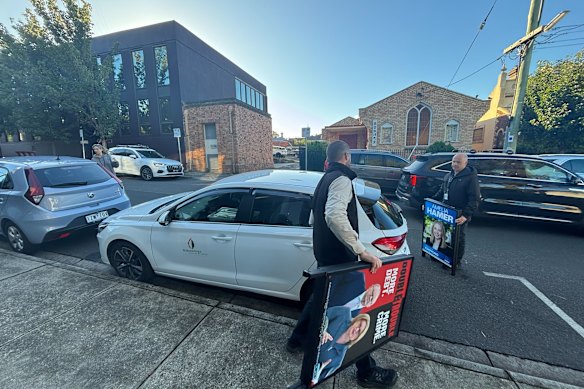 Council officers confiscated 14 signs at the Kew pre-poll voting booth.