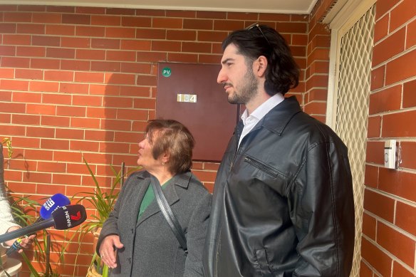 Carmela Fato and grandson Carlos Pereyra speak to reporters after an injured baby was found at the home opposite.