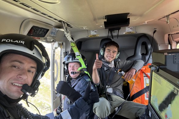 Nazari with rescue personnel in the helicopter that winched him to safety.