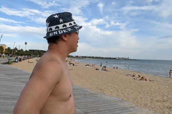 Paul Nguyen had his last ocean swim before the weekend’s wintry blast forces his to pack away his flippers.