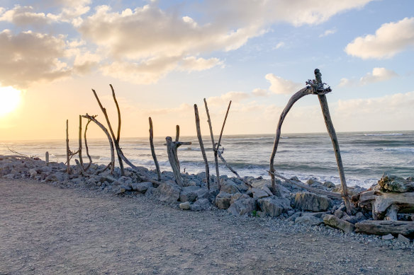 Hokitika arty side comes through at the beach in driftwood lettering.