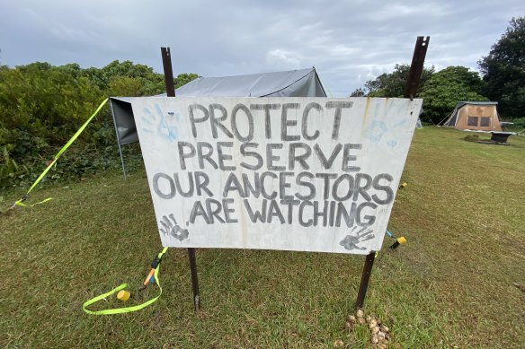 A sign at Minjerribah’s Point Lookout critical of plans to include the humpback whale skeleton inside the whale observation centre.