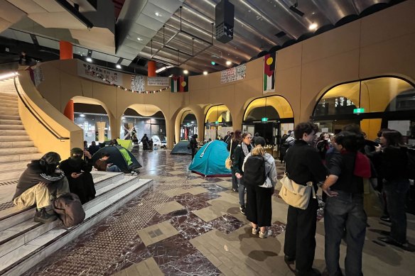 Students gather in the central lobby of the Arts West building at Melbourne University on Thursday night.