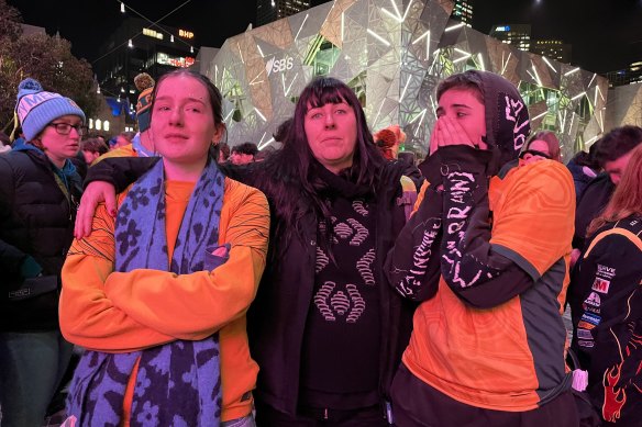 Matildas fans Stella Snowden, Ines de-bleye, and Ella van der Lans after their semi-final loss.