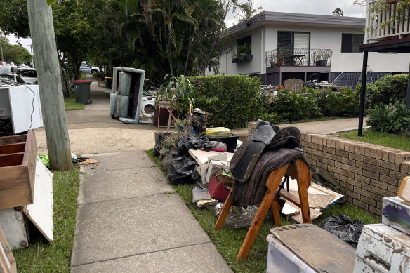 Clean-up along the streets in Brisbane’s inner north-west on Monday.