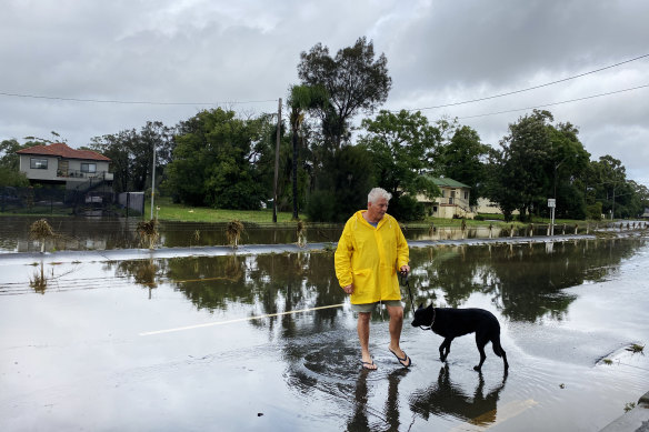 Chipping Norton resident Bernie King inspecting the flooding along Newbridge Road.