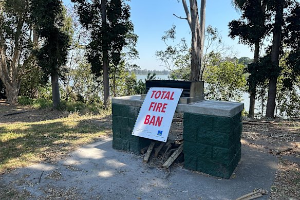 Total fire ban signs at a Brisbane barbecue area on Tuesday. 