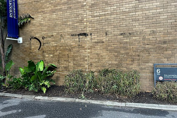 Graffiti reading ‘Death to Herzog’ has been largely scrubbed from a University of Melbourne building.