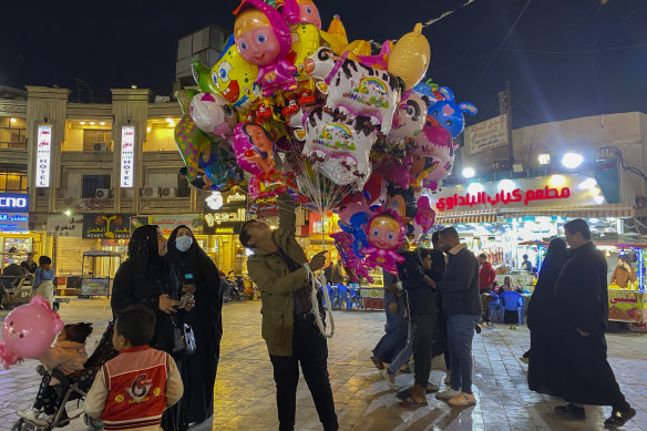 A street vendor sells balloons and toys in Baghdad’s Kadhimiya district.