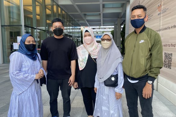 Nasiari Sunee’s family, including his son Muhammad (right) and his wife Manisah (second from right) outside Singapore’s state court on Friday after the sentencing of Australian man Andrew Gosling for his death in 2019. 