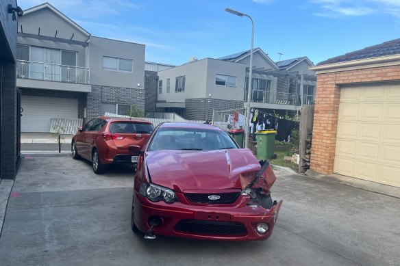 A damaged car in a laneway where a driver crashed into two children on Tuesday evening.
