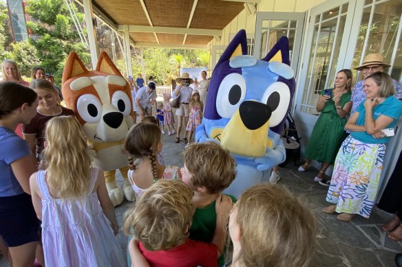 Bluey and sister Bingo pose with children at Brisbane’s Howard Smith Wharves, where the Bluey’s World tourist attraction was announced on Sunday.