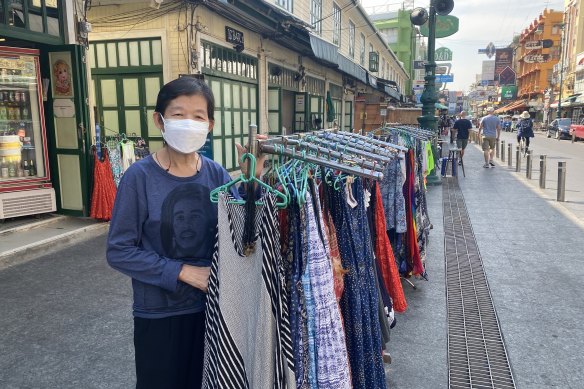 Thaunaut, a Thai clothing vendor, has found business slow going on Khaosan Road. 