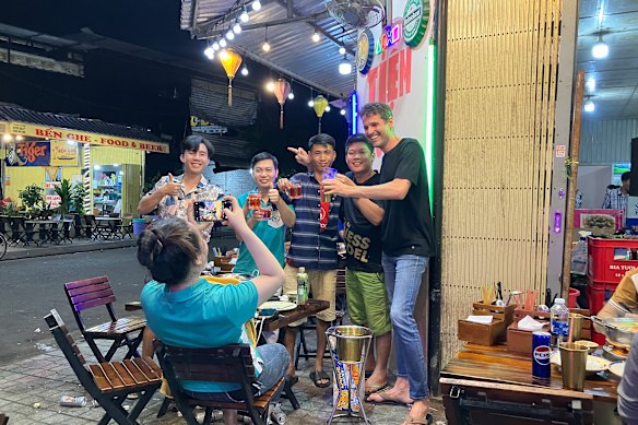 The author, far right with new friends, says learning a little local lingo can open doors that may otherwise stay closed.