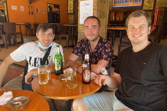 English tourist Fraser James, left, with backpacking friends on Khaosan Road.