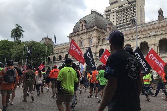 Construction workers march to Parliament House on Wednesday.