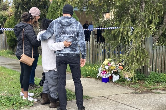 Family members and friends of Tiffany Woodley at the scene in 2023.